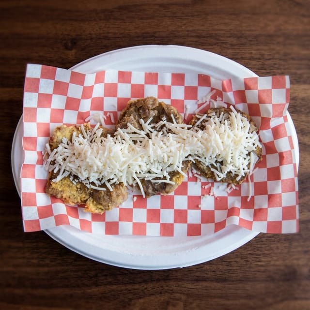 Patacones w/ White Shredded Cheese.